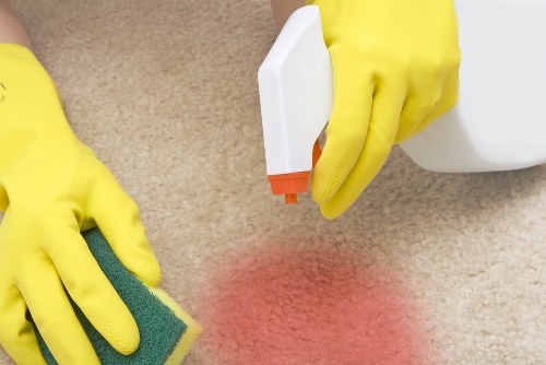Technician preparing carpet cleaning equipment safely in Maidavale